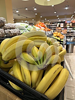 ripe bananas on a fruit counter in a store