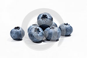 Ripe blueberries on a white background fully in focus