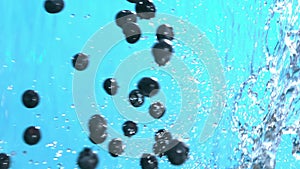 Ripe Blueberry Falling into Water Splash Cascade in Slow Motion Shot 4k