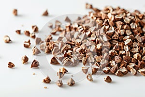 Ripe buckwheat grains on a white background.