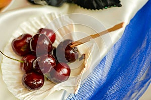 Ripe cherries arraged into a seashell