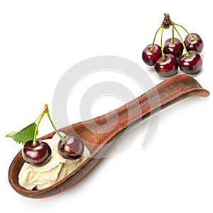 Ripe cherries and creamy mousse isolated on white . Place for your text