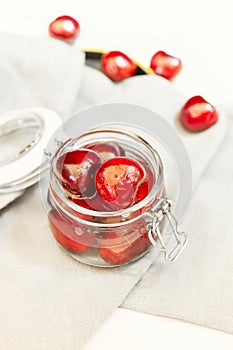 ripe cherries in a glass jar