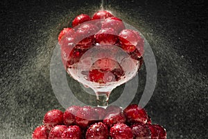 Ripe cherries in a glass
