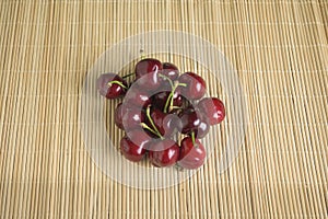 Ripe cherries ready to eat on bamboo hemp tatami in Japan photo