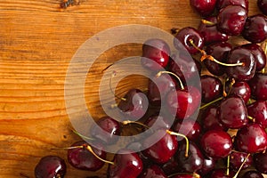 Ripe cherries on rustic wooden background