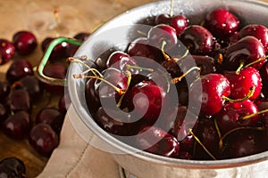 Ripe cherries on rustic wooden background