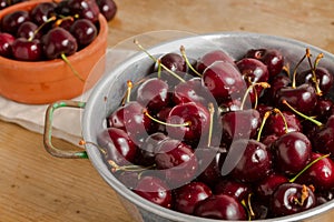 Ripe cherries on rustic wooden background