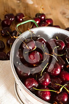 Ripe cherries on rustic wooden background