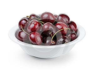 Ripe cherries in white bowl
