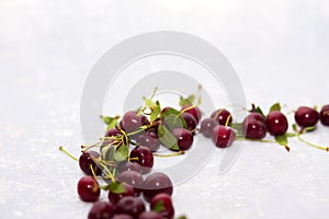 Ripe cherry on a light gray background, selective focus