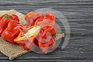 Ripe Chili Peppers on wooden background. Capsicum baccatum