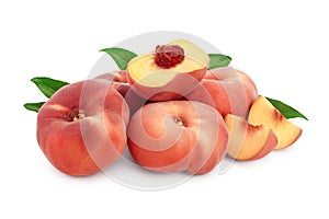 Ripe chinese flat peach fruit and half with leaf isolated on white background