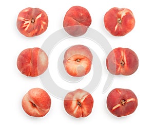 Ripe chinese flat peach fruit with leaf isolated on white background. Top view. Flat lay. Set or collection