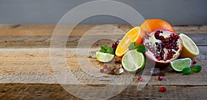 Ripe Citrus Fruit on the Old Wooden Table. Orange, Lime, Lemon Mint. Healthy Food. Summer Background.