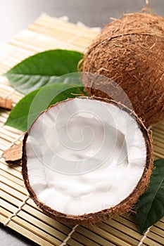 Ripe coconut with cream on bamboo mat