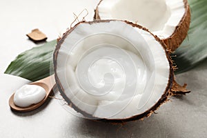 Ripe coconut and cream on light grey table