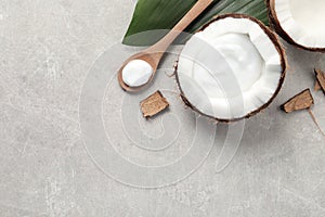 Ripe coconut and cream on light grey table, flat lay. Space for text