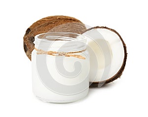 Ripe coconuts and jar with organic oil on background. Healthy cooking