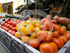 Ripe colorful tomatoes on a street stall in France