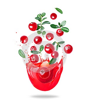 Ripe cranberries with leaves in splashes of juice on a white background
