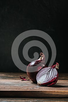 ripe cut red onion on cutting board