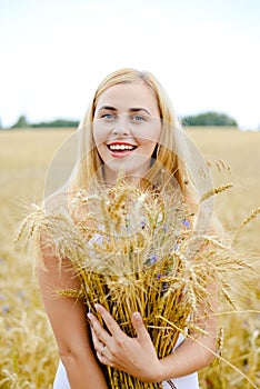 Ripe ears wheat in woman hands against a