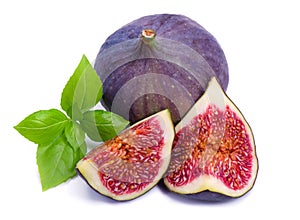 Ripe fig with green leaf basil