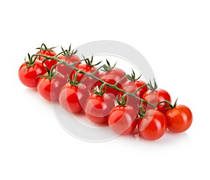 Ripe fresh cherry tomatoes on branch isolated on white background.