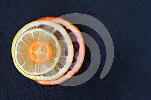 Ripe fresh citrus pulpy macro dark background