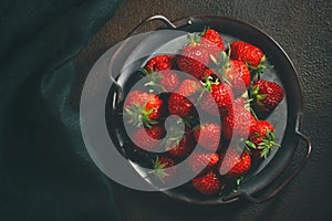Ripe fresh farmed natural strawberries on a metal tray on the table, flat lay, top view