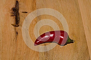 Ripe Fresh large Red Chili wooden Background in detail