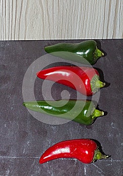 Ripe Fresh large Red and Green Chili`s Slate Background in detail