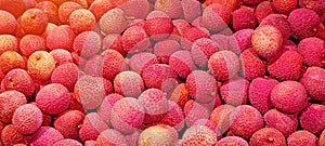 Ripe fresh Lychee (Litchi) background. Healthy, organic, juicy fruit in the sunny summer day. Copy space.