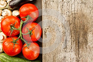 ripe fresh vegetables on wooden background. The icon for healthy eating, diets
