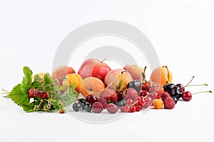 Ripe fruits and berries on a white background