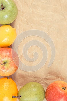 Ripe fruits on old paper. Healthy lifestyle. Fruits as source minerals and vitamins. Place for text