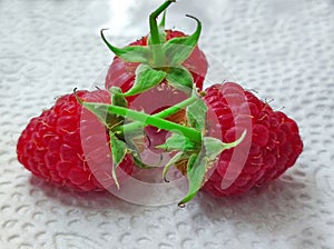 Ripe fruits of wild raspberries in close-up.