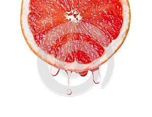 Ripe grapefruit and drops of juice