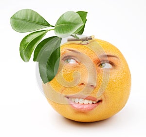 Ripe grapefruit with a person smiling girl