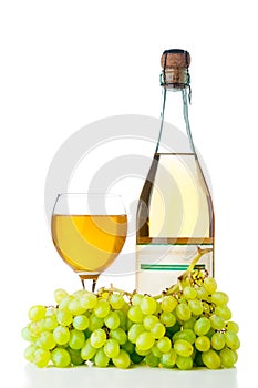 Ripe grapes, wine glass and bottle