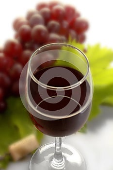 Ripe grapes, wine glasses and bottles of wine corkscrew isolated
