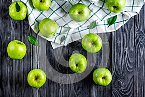 Ripe green apples dark wooden table background top view