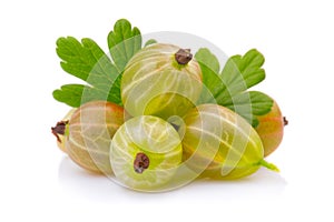 Ripe green gooseberries with leaves isolated on white