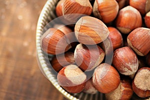 ripe hazelnuts close-up in a cup on a wooden table.Vegetable protein source. healthy snack. Healthy fats. Farmed organic