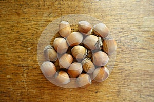 Ripe hazelnuts on wooden table