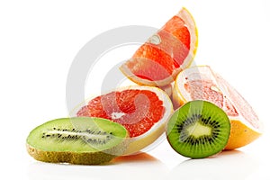 Ripe and juicy fruits of grapefruit and kiwi and their parts close-up isolated on white background.