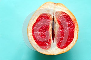 ripe juicy grapefruit isolated on a blue background