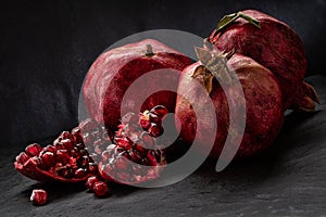 Ripe juicy pomegranate and its parts