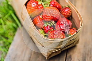 Ripe juicy strawberries in vintage basket